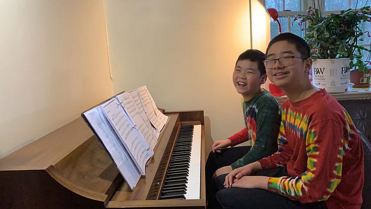 two boys at the piano
